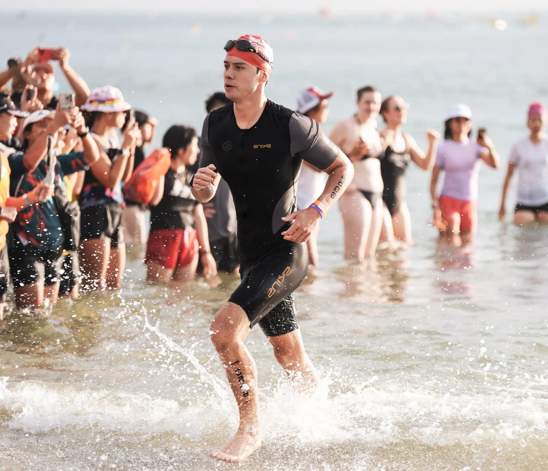 Mike Dee running out of the water during the Ironman swim leg